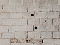 White brick background. Dirty texture of an old wall painted white. Architecture and construction Royalty Free Stock Photo