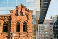 Architecture contrast old house and a new modern building Royalty Free Stock Photo