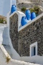 Architecture with decorative blue pots of Fira city on Santorini island, Greece Royalty Free Stock Photo