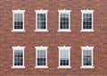 Brick house facade wall with windows Royalty Free Stock Photo