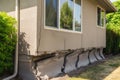 Architecture detail of damaged house dilapidated old building wall. Private abandoned home fall to ruin. Consequences of Royalty Free Stock Photo