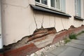 Architecture detail of damaged house dilapidated old building wall. Private abandoned home fall to ruin. Consequences of Royalty Free Stock Photo