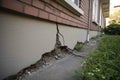 Architecture detail of damaged house dilapidated old building wall. Private abandoned home fall to ruin. Consequences of Royalty Free Stock Photo