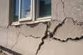 Architecture detail of damaged house dilapidated old building wall. Private abandoned home fall to ruin. Consequences of Royalty Free Stock Photo