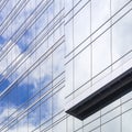 Architecture detail Glass facade pattern Modern building reflect blue sky