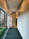 Architecture detail house gallery corridor with glass wall and plain wall Royalty Free Stock Photo