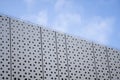 Architecture detail of a modern building with a blue sky on background. Facade design. Royalty Free Stock Photo