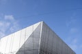 Architecture detail of a modern building with a blue sky on background. Facade design. Royalty Free Stock Photo