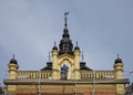 Architecture detail on the top of Bishop`s palace during restauration, with worker on the