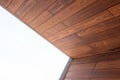 Architecture detail of wooden cladding and white sky light background Royalty Free Stock Photo