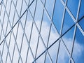 Architecture details Modern Building Glass facade steel pattern Reflection blue sky