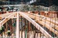 Architecture dome details at construction site. Industrial roof system of monastery building with wooden timber, beams and shingle Royalty Free Stock Photo