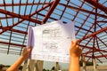 Architecture drawings in hand on house building