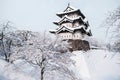 Architecture of Hirosaki Castle in winter season, covered with w