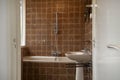 Architecture interior of a old vintage bathroom with brown tiles, Antique design, interior house concept Royalty Free Stock Photo