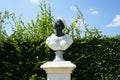 A bust of an African woman is placed on a pedestal in the park. Potsdam, Germany