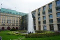 Historic fountain on Pariser Platz surrounded by flower beds in the center of Berlin near Brandenburg Gate. Berlin, Germany.