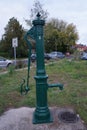 Old water column stands on the street in a residential area of the city. Berlin, Germany Royalty Free Stock Photo