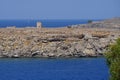 View of the old windmill on the coast of Lindos in August. Lindos, Rhodes Island, Dodecanese, Greece Royalty Free Stock Photo