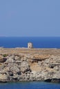 View of the old windmill on the coast of Lindos in August. Lindos, Rhodes Island, Dodecanese, Greece Royalty Free Stock Photo