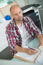 Architecture man writing paper at table office Royalty Free Stock Photo