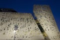 Architecture at night of the facade of Palazzo Italia