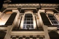 The architecture of the old building in the shadows of the night lights.