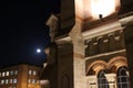 The architecture of the old building in the shadows of the night lights.