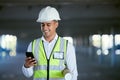 Architecture, phone and happy man with blueprint, reading email or social media at construction site in communication