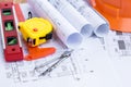 Architecture plan and rolls of blueprints with tool kit Royalty Free Stock Photo