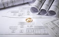 Architecture plans with wedding rings Royalty Free Stock Photo