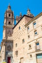 Architecture in Salamanca, Spain; view of the Casa de las Conchas and a Baroque church in the background Royalty Free Stock Photo