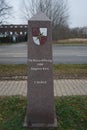 Marble pillar with the inscription `The opening of the Wall in 1989 began here. October 3, 2013`. 12529 Schoenefeld, Germany