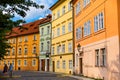 The architecture of the strago city of Prague. Multi-colored low buildings and stone paving stones. Streets of old Europe