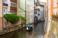 The architecture of the strago city of Prague. River channel in the city. Streets of old Europe, cityscape