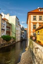 The architecture of the strago city of Prague. River channel in the city. Streets of old Europe, cityscape