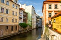 The architecture of the strago city of Prague. River channel in the city. Streets of old Europe, cityscape