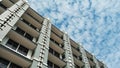 Architecture of Tall Building Against Cloudy Sky Royalty Free Stock Photo