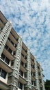 Architecture of Tall Building Against Cloudy Sky Royalty Free Stock Photo