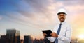 Architect or businessman in helmet with tablet pc Royalty Free Stock Photo