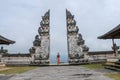 Architecture, traveling and religion. Young traveler enjoying the view in Hindu temple Lempuyang in Bali, Indonesia