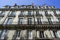 Architecture typical of French tenement houses. Bright facade