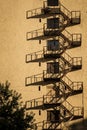 Architecture white high rise office building with shadow of metal fire escape Royalty Free Stock Photo
