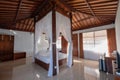 Architecture wooden bedroom balinese style with curtain of tropical villa Royalty Free Stock Photo