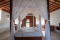 Architecture wooden bedroom balinese style with curtain of tropical villa Royalty Free Stock Photo