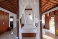 Architecture wooden bedroom balinese style with curtain of tropical villa Royalty Free Stock Photo