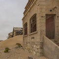 The Architekt house at German Kolmanskop Ghost Town with the abandoned buildings in the Namib desert Royalty Free Stock Photo