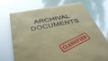 Archival documents classified, seal stamped on folder with documents, close up Royalty Free Stock Photo