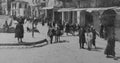 Archival monochrome photo taken in 1920 near Jaffa Gate in Jerusalem Palestine, now Israel. Photo shows buildings and people.