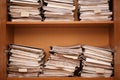 Archive. Wooden shelves with paper folders Royalty Free Stock Photo